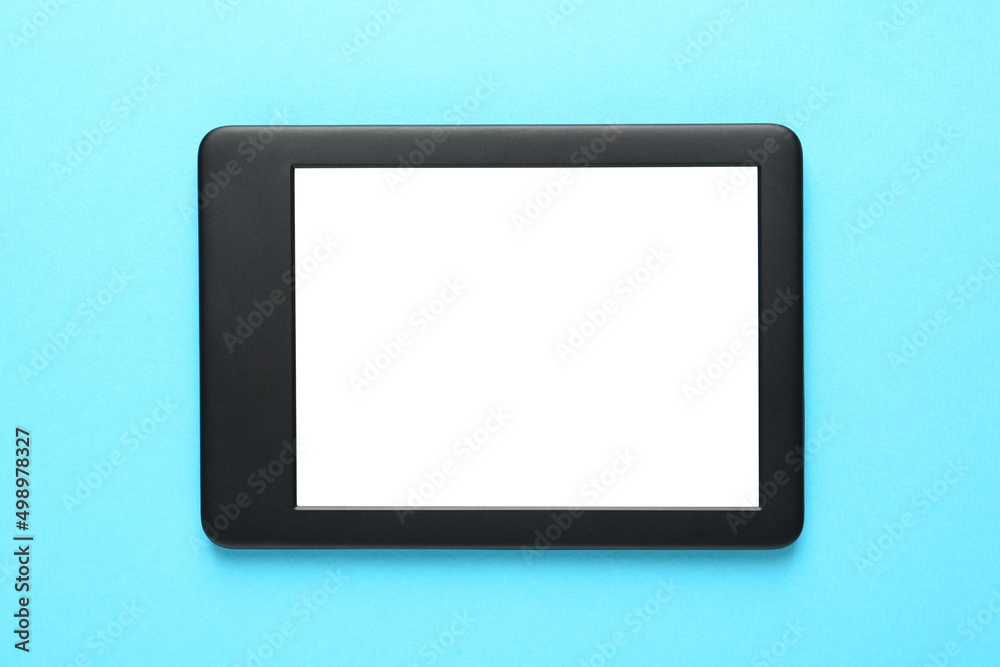 Modern e-book reader with blank screen on turquoise background, top view Modern e-book reader with blank screen on turquoise background, top view