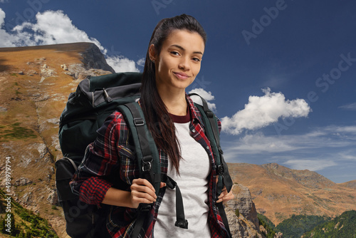 Young female hiker with a backpack photo