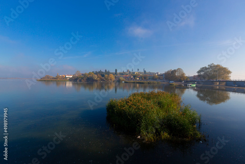 Beautiful sunset sky and fisherman boats reflection in water view of the birds paradise lake manyas photo