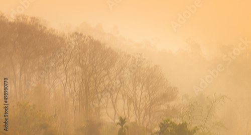 Prolonged dust storm in dry winter subtropics. Soil drought dust devil has reached foothills. Climate change, desiccation of climate leads to aridization of new areas, aridity of ecosystems