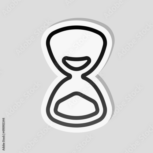 Old hourglass, simple wait icon. Linear sticker, white border and simple shadow on gray background