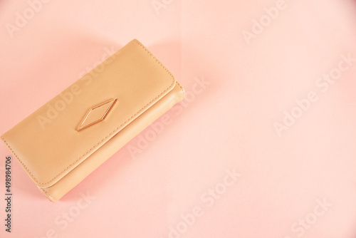 woman   wallet on the pink  table