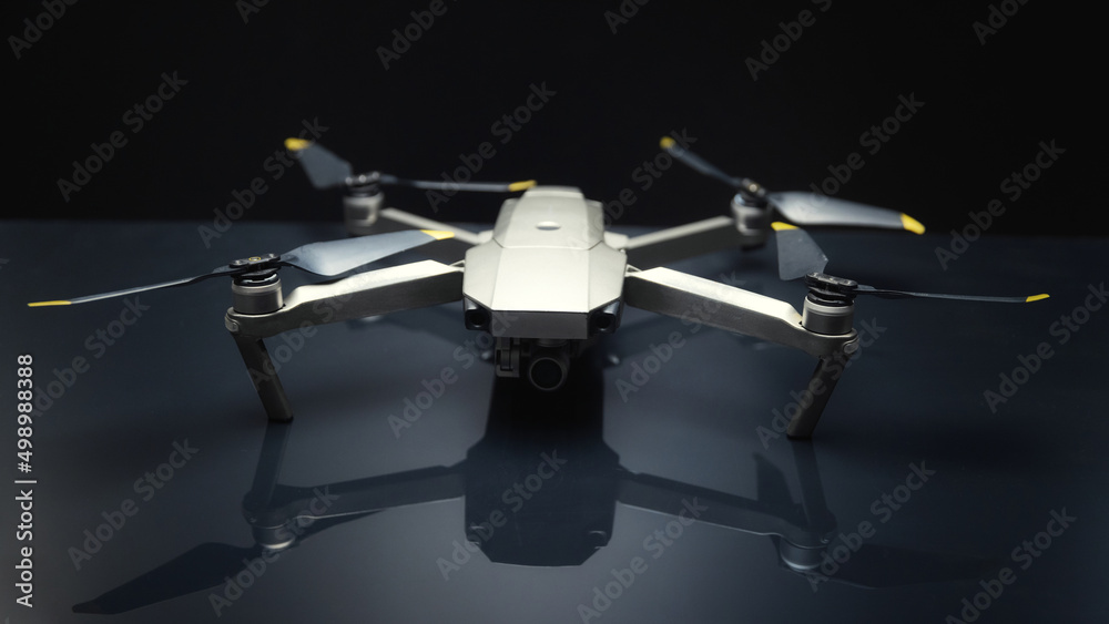 Grey drone against black background closeup photo Grey drone against black background closeup photo