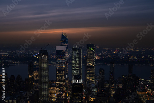 city skyline at night with orange colors and building in the New York 