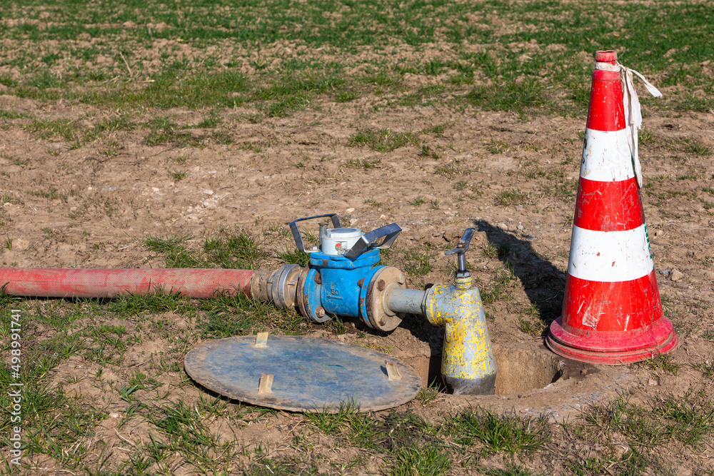 water meter with pump on the field - obrazy, fototapety, plakaty 