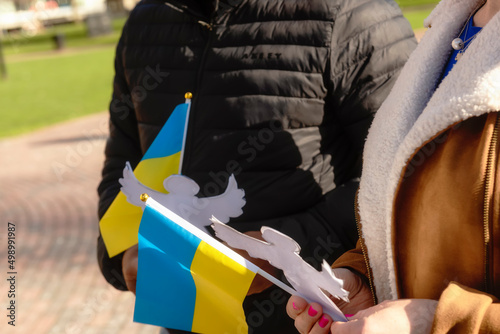 People with flags of Ukraine in their hands at a rally in support of peace in Ukraine. Boston. April 2022 USA.