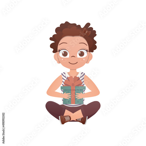 A happy girl sits in a lotus position with a gift in her hands. Cartoon style. Vector.