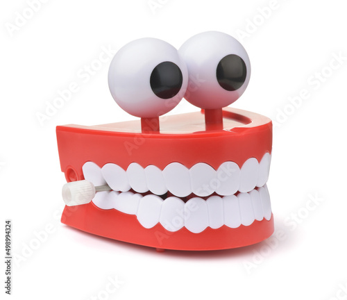 Fotografija Funny toy clockwork jumping teeth with eyes