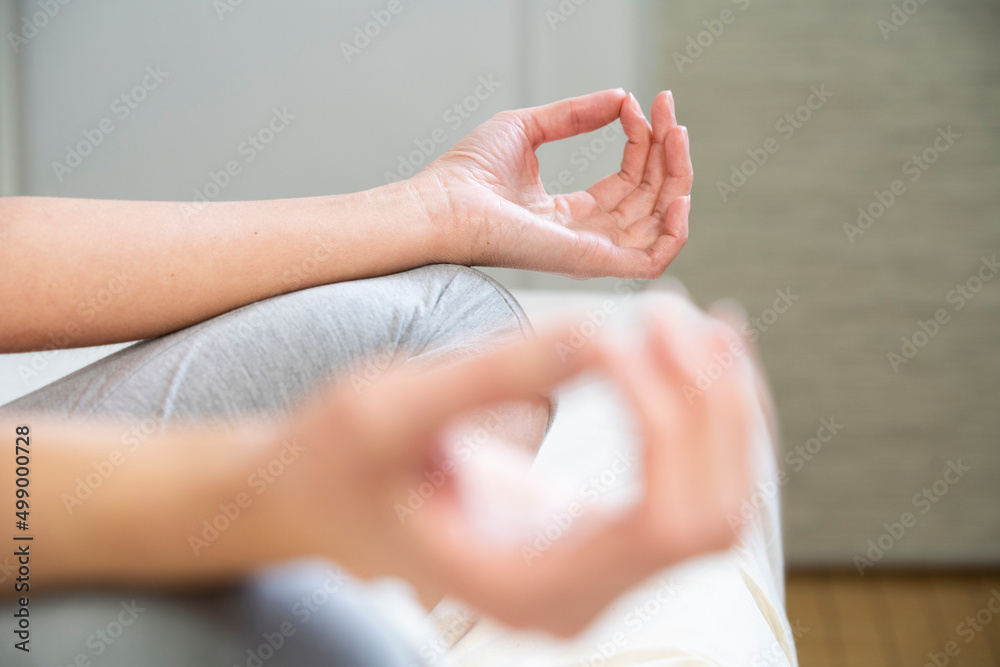 Close-up of woman's hands during a meditation session. Close-up of woman's hands during a meditation session.