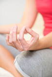 Close-up of woman's hands during a meditation session.