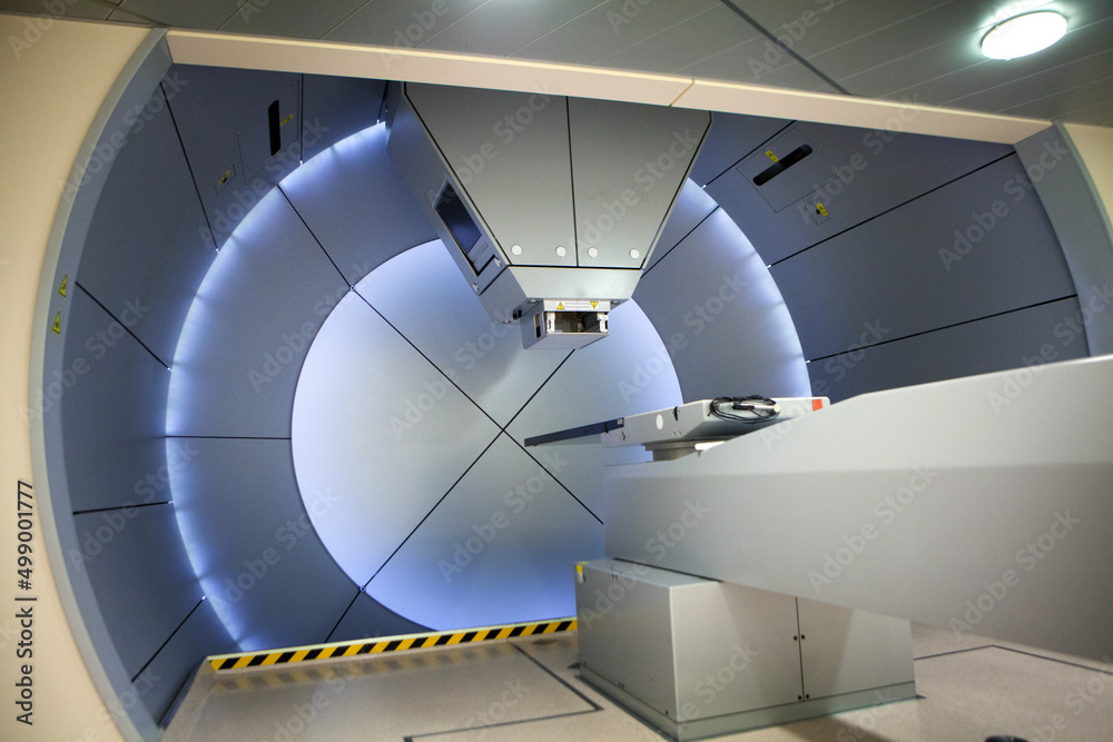 Proton therapy irradiates cancer cells with a beam of protons inside. - obrazy, fototapety, plakaty 