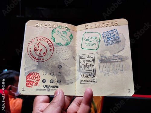 Canvas Print Delhi, India- March 21 2022: Colorful stamps of various countries on the passport