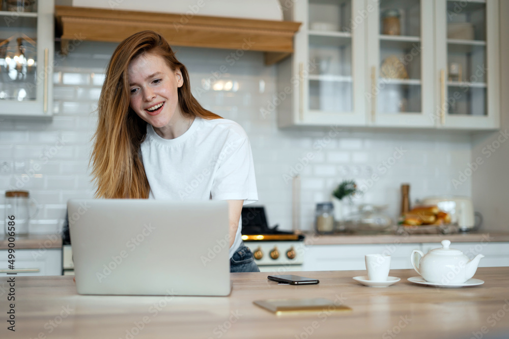 A woman online learning education at home, uses a laptop and an Internet site A woman online learning education at home, uses a laptop and an Internet site