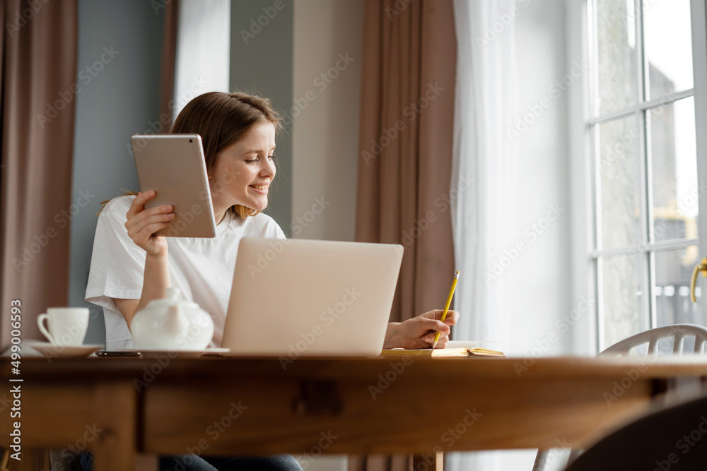 Woman online learning education at home, uses laptop and internet Woman online learning education at home, uses laptop and internet