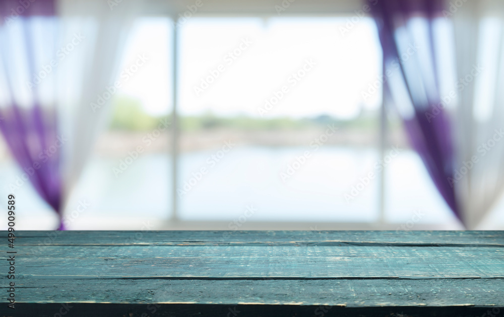 Empty wooden table top with lights bokeh on blur restaurant background. Empty wooden table top with lights bokeh on blur restaurant background.