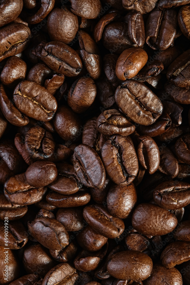 Top view of the texture of roasted ready-to-drink coffee. Scene of coffee beans. Black ground coffee Top view of the texture of roasted ready-to-drink coffee. Scene of coffee beans. Black ground coffee