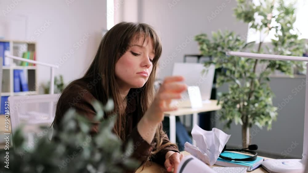 Boring woman trying to work at coworking. Bored businesswoman tired during working with colleagues in the office. High quality 4k footage Boring woman trying to work at coworking. Bored businesswoman tired during working with colleagues in the office. High quality 4k footage