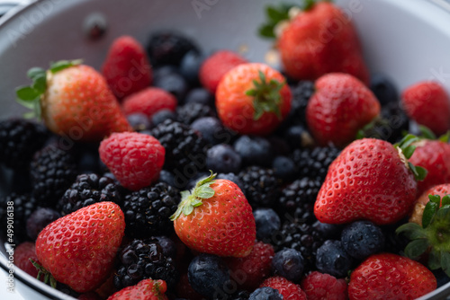 berries in white antique strainer