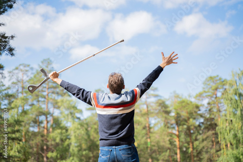 a disabled man with a walking stick rejoices in healing recovery