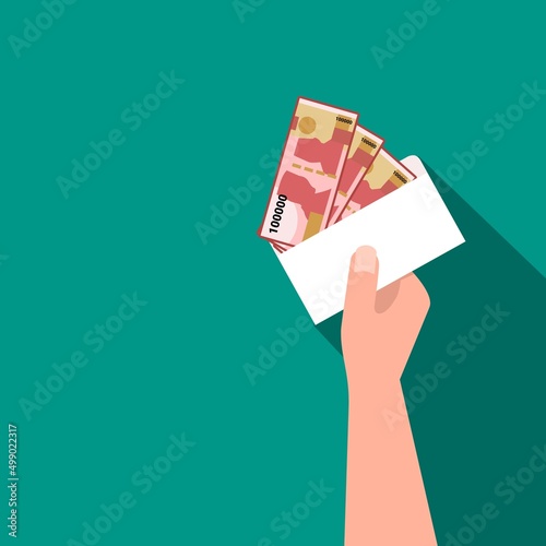 Vector illustration, hand holding an envelope containing Indonesian rupiah IDR for THR, THR is holiday allowance money that workers in Indonesia get before Eid al-Fitr.