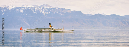 Fotografie, Obraz Panoramic banner with steam boat with swiss and french flags floating on Lake Ge
