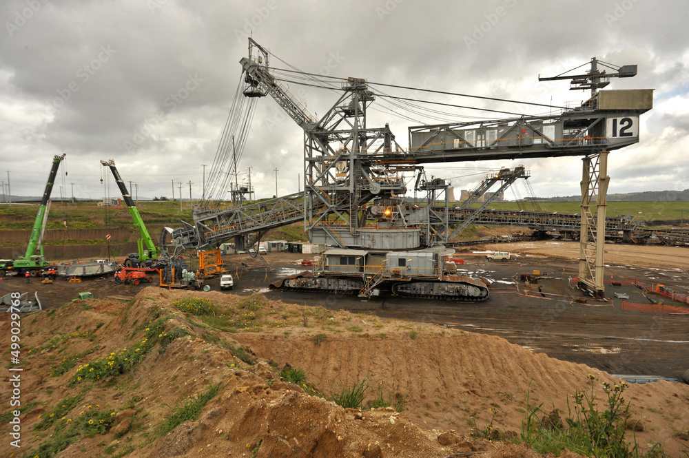 Dredger maintenance-replacing bucket wheel on site Yallourn opencut coal mine Dredger maintenance-replacing bucket wheel on site Yallourn opencut coal mine