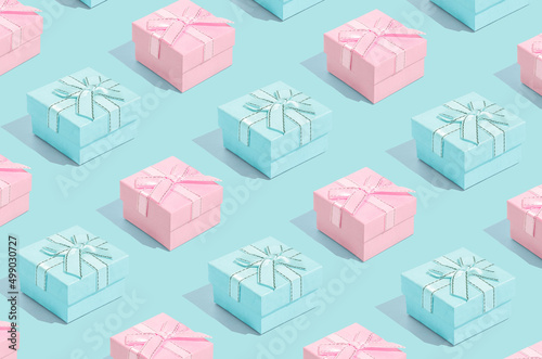 Minimal composition background of pastel pink and blue Christmas gift box. New Year concept.