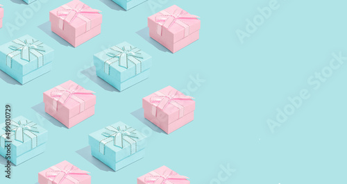 Minimal composition background of pastel pink and blue Christmas gift box. New Year concept.