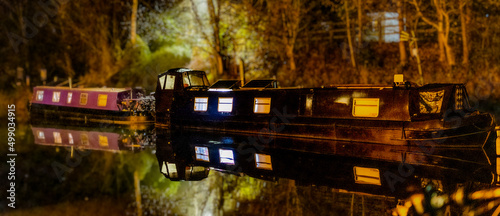 Schilderij op canvas boats on a canal at night