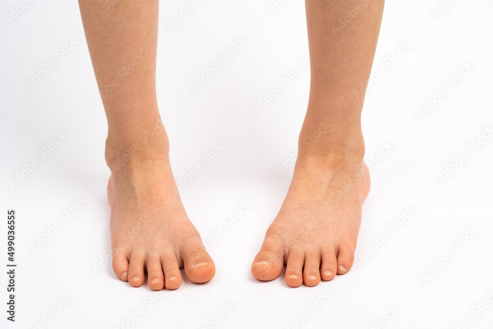 children's feet on a white background rear view, the concept of ...