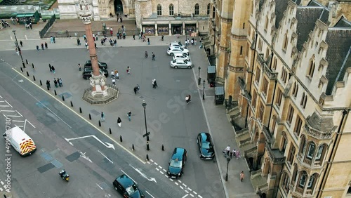 Aerial top view of many tourists in front of Westminster Abbey, London. Scenic view from the top of busy London at famous tourist attractions.
Aerial top view of many tourists in front of Westminster  photo