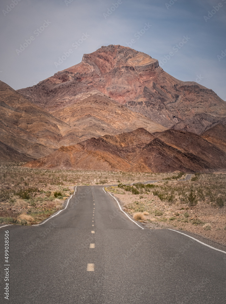 Lonely Death Valley road wanders in the desert