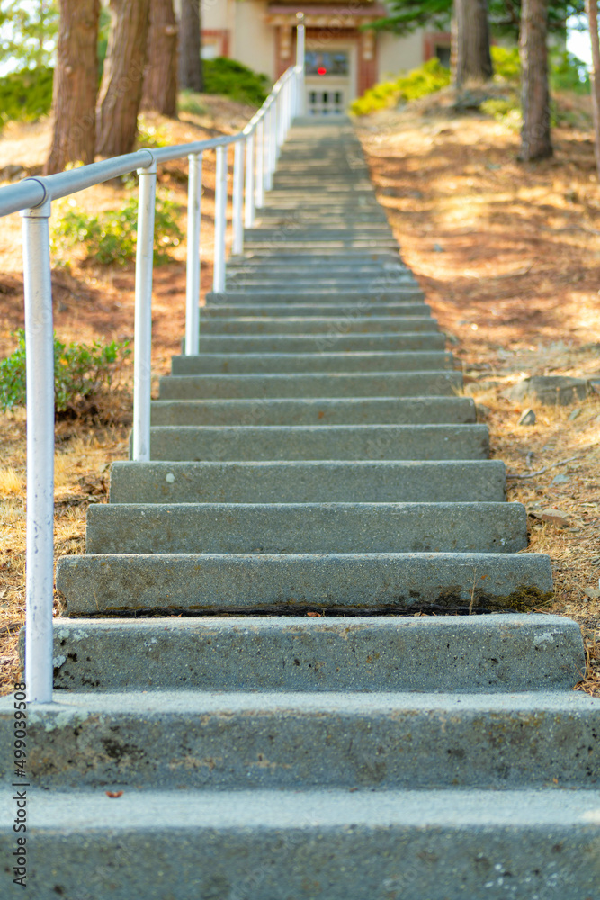 long set of stairs with metal railing