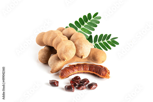 Pine of Tamarind fruits with leaves on white photo