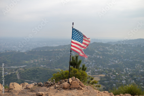 Los Angeles, California, USA - April 11, 2022: Sweeping view of Los Angeles and American flag from Wisdom Tree viewpoint