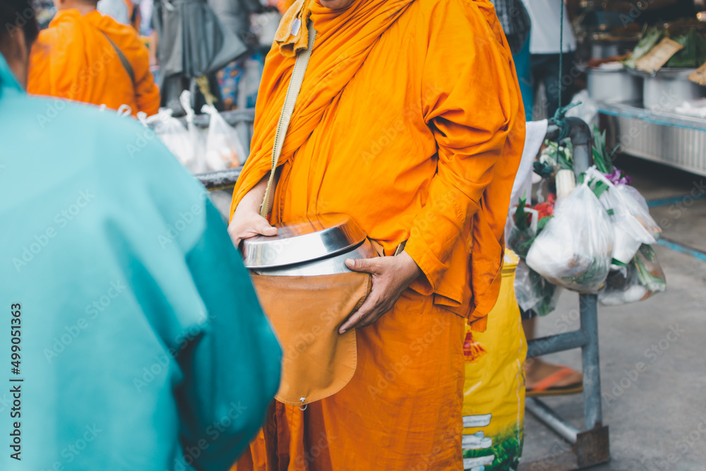 Thai monk ask for alms for buddhist to make merit Thai monk ask for alms for buddhist to make merit
