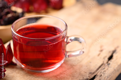 Roselle tea on wooden background, Healthy herbal drink