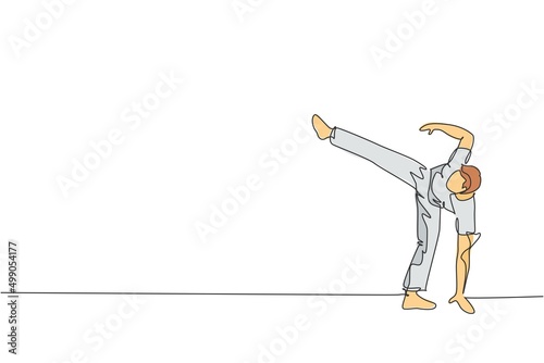 One continuous line drawing capoeira young sporty Brazilian fighter man training capoeira on beach. Healthy traditional fighting sport concept. Dynamic single line draw design vector illustration