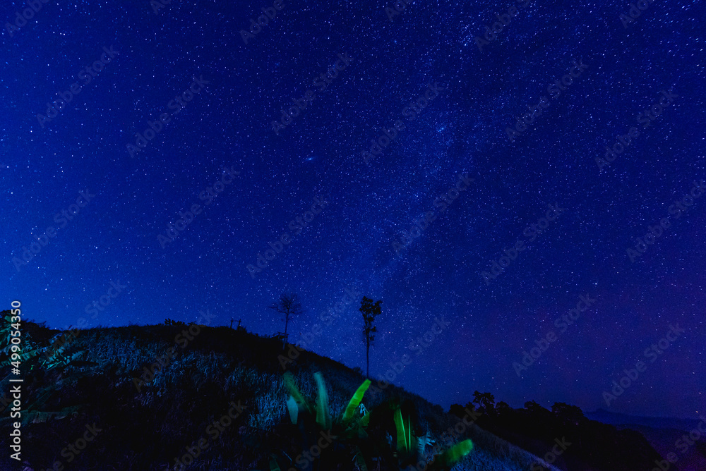 The sky dark blue with many stars and mountain range The sky dark blue with many stars and mountain range