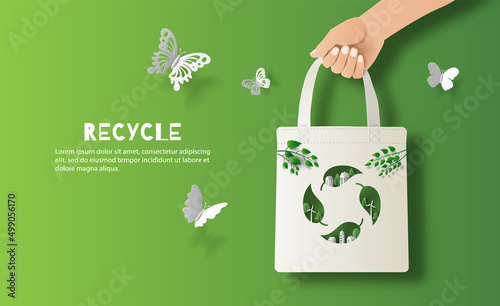 Recycle banner design, hand holding eco bag, save the planet and energy concept, paper illustration.