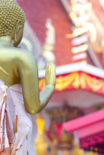 Buddha giving blessings in a temple in Thailand photo