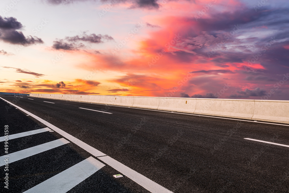 Asphalt road and colorful sky cloud landscapes at sunrise