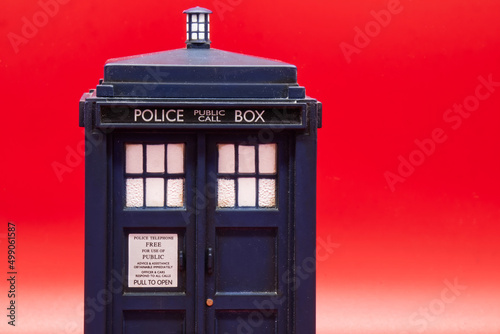 Fototapeta Police call box isolated on red background