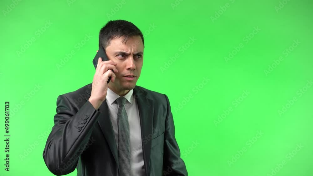 Cheerful man in suit talking on phone Cheerful man in suit talking on phone