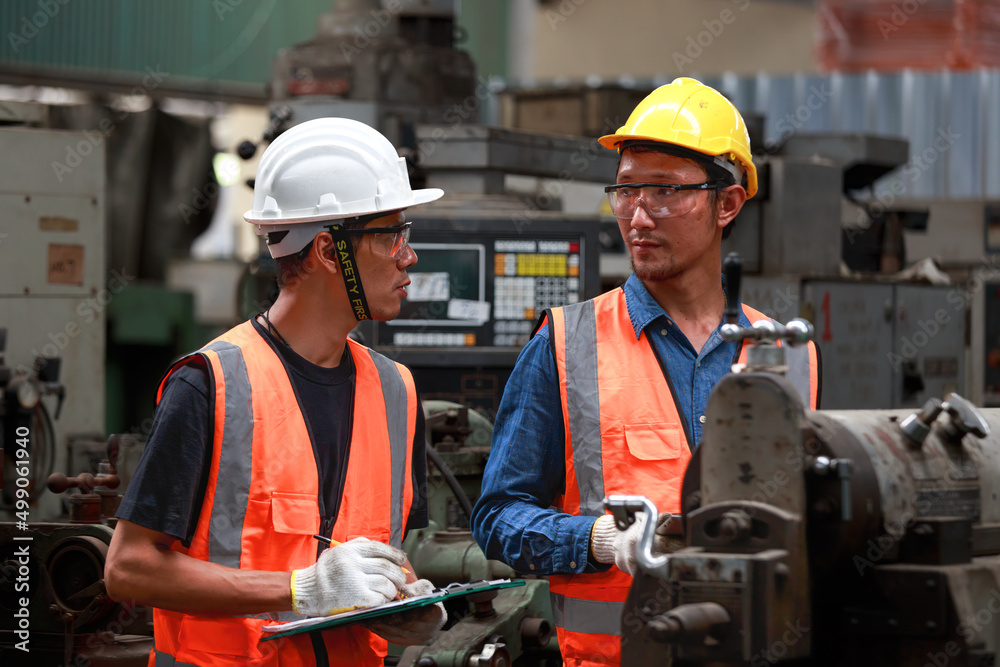 Asian male engineer team monitors and control Planning for maintenance of metalworking machines in industrial plants, Asian male engineer team monitors and control Planning for maintenance of metalworking machines in industrial plants,