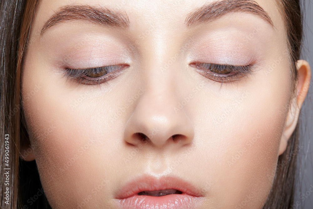 Closeup portrait of human female face with nude makeup. Closeup portrait of human female face with nude makeup.