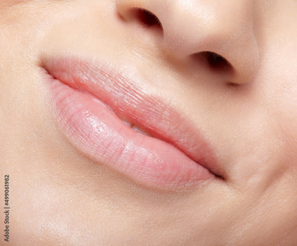 Fototapeta premium Closeup macro portrait of young female part of face with no makeup.