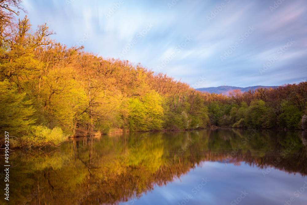  Panorama of a lake in Maksimir park with reflections and a mountain Medvednica in Zagreb