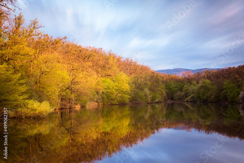  Panorama of a lake in Maksimir park with reflections and a mountain Medvednica in Zagreb