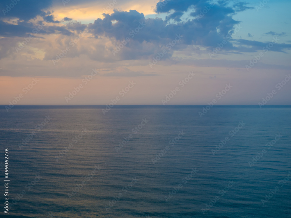Morning landscape with cloudy sky and ripples at sea in Ukraine. Beautiful colorful seascape. Wide deep blue sea ocean ripples. Nautical background
